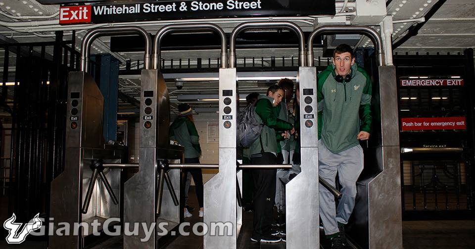 Ruben Guerrero squeezes through the subway turnstile